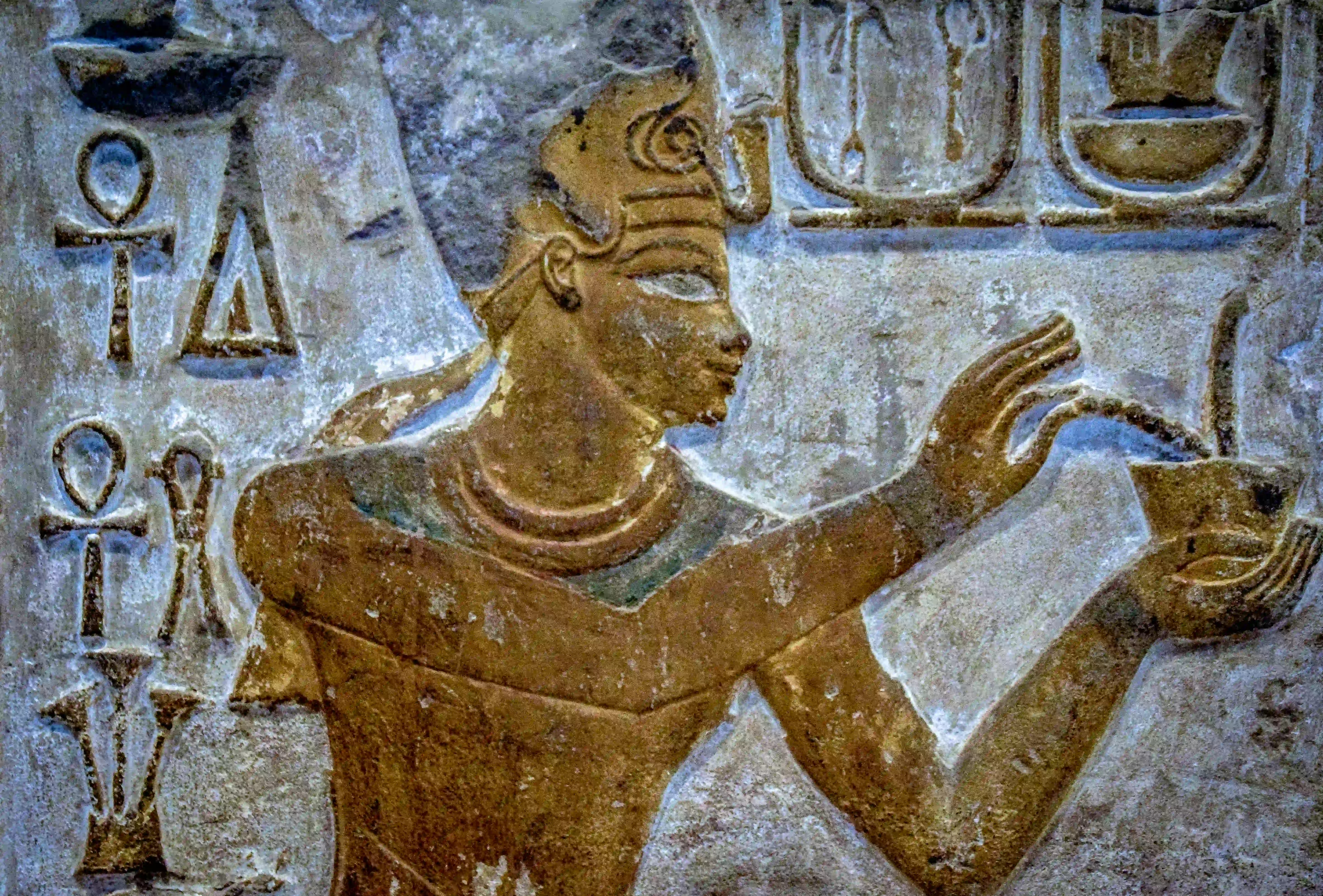 Painted ancient Egyptian relief with ankh symbols